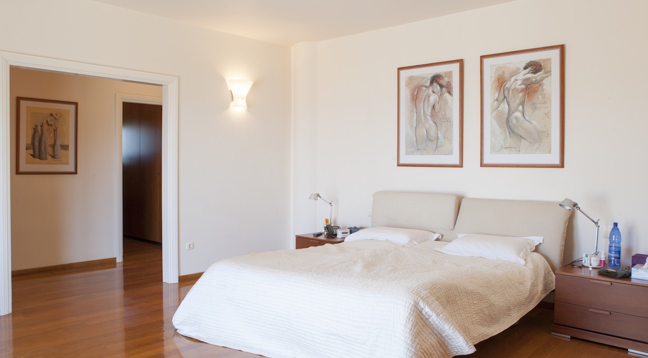 The bedrooms have beautiful wooden flooring property for sale in Rhodes, Greece