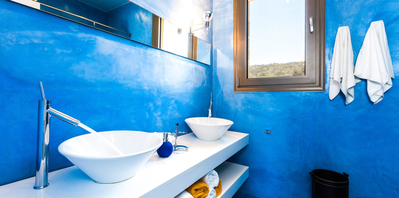 One of the bathrooms in blue villa for sale in Crete Greece